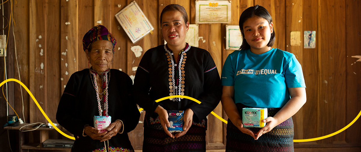 Multigenerational group of women holding feminine products in support of Menstrual Health Day