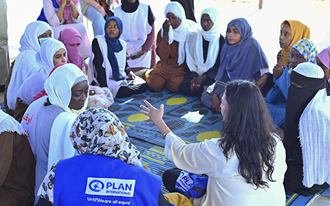 A group of women seated in a circle for a discussion