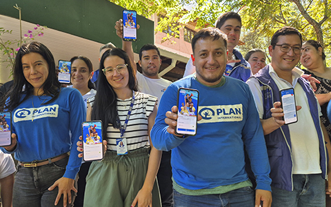 Group of smiling people with Plan International